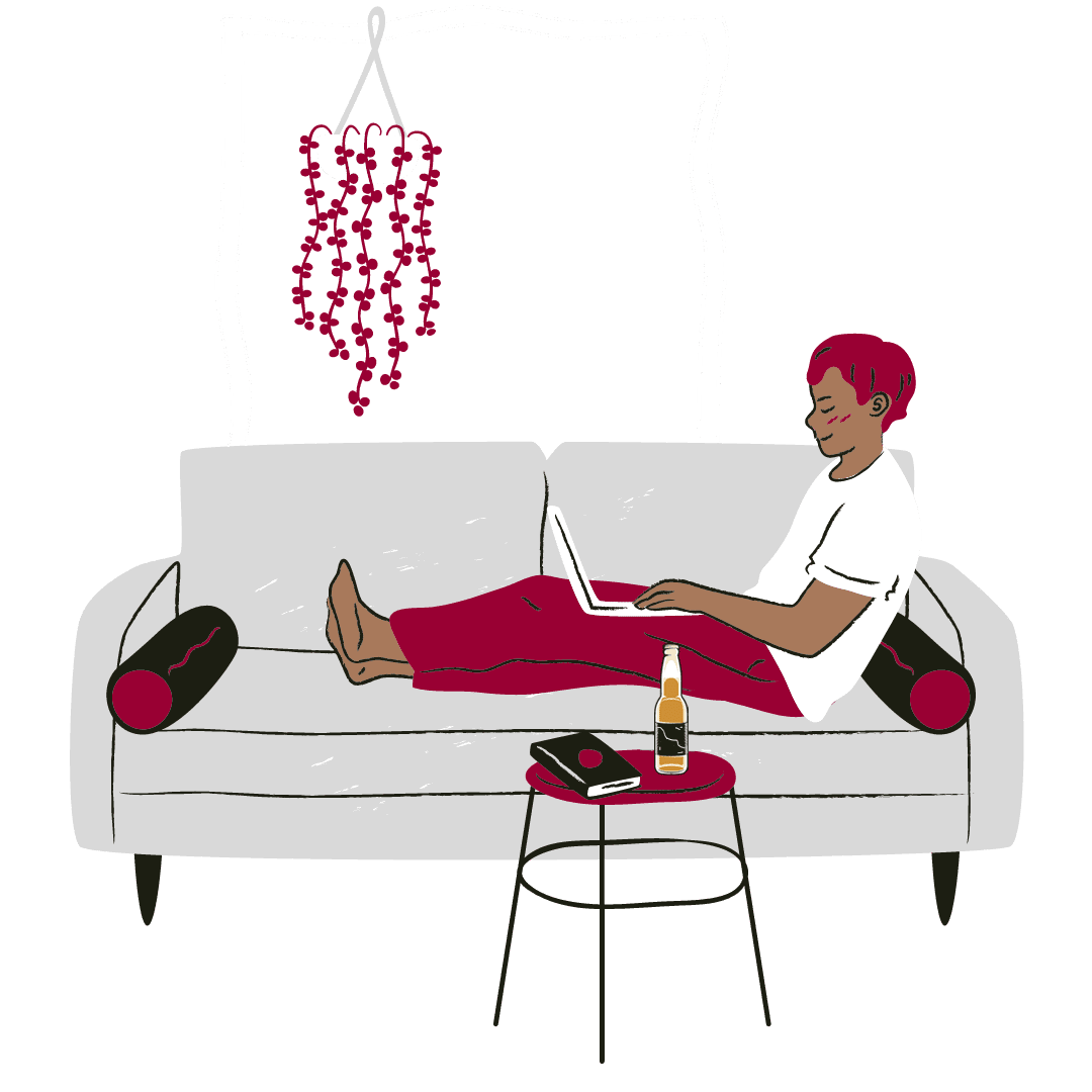 Male cartoon character sitting on a couch with his laptop on his lap and a beer on his table